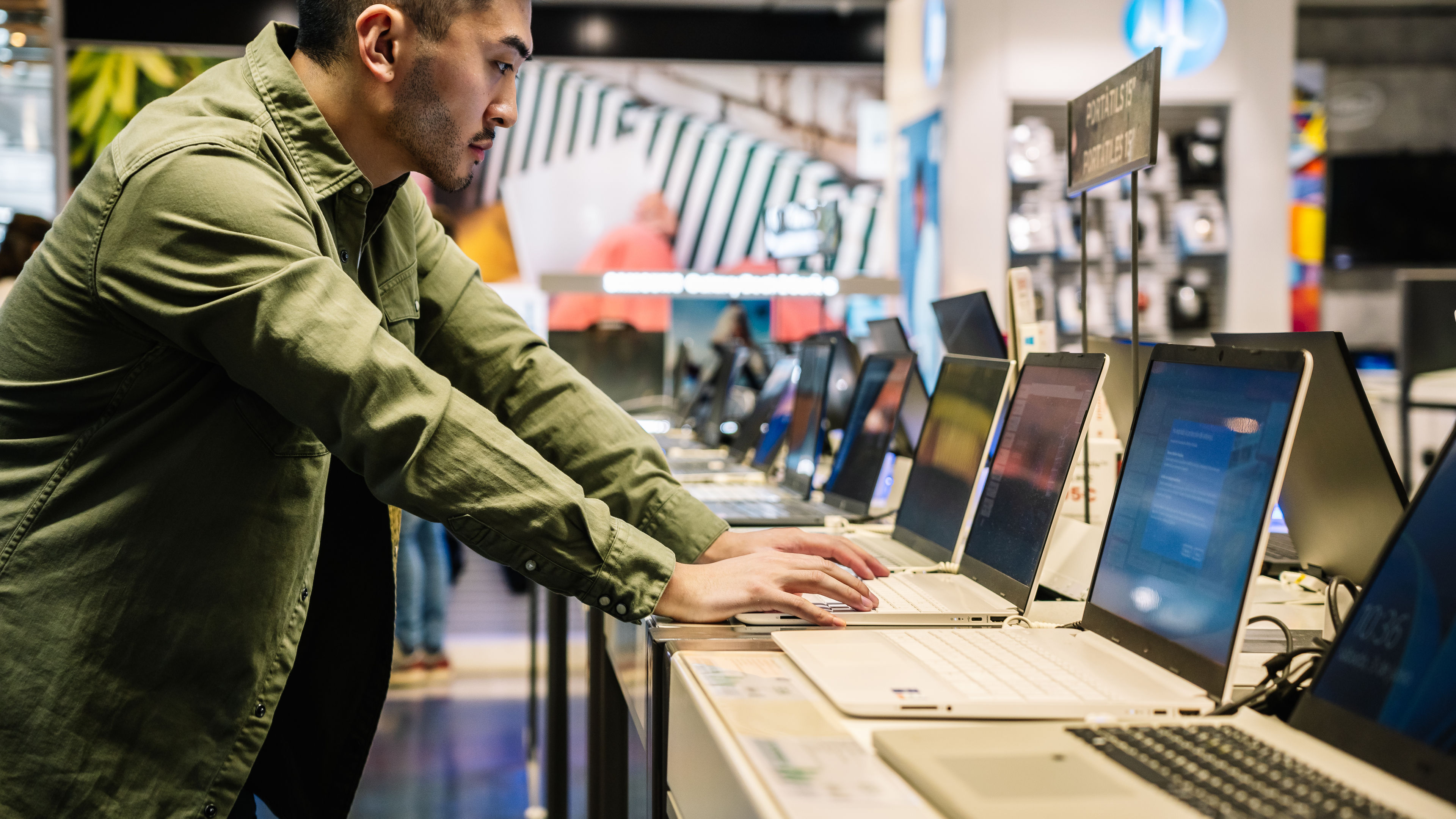 Young man selecting tech gadgets