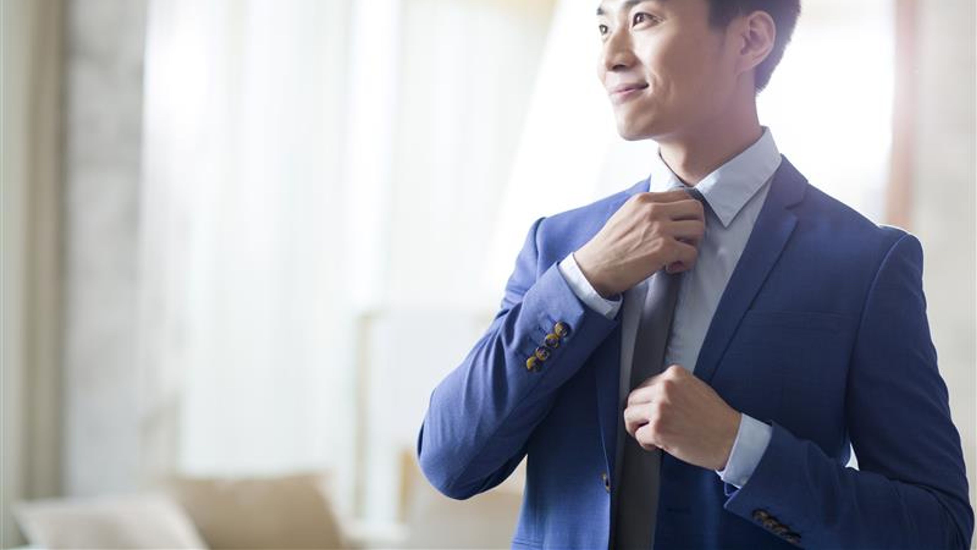 A man getting dressed well