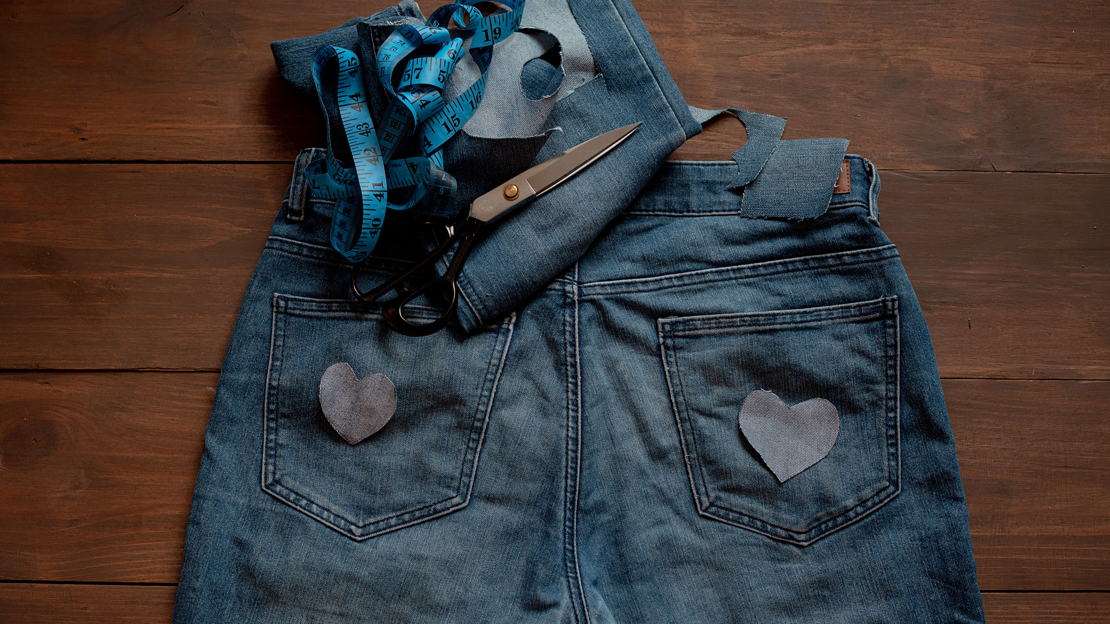 A pair of denim jeans has been cut and upcycled into shorts