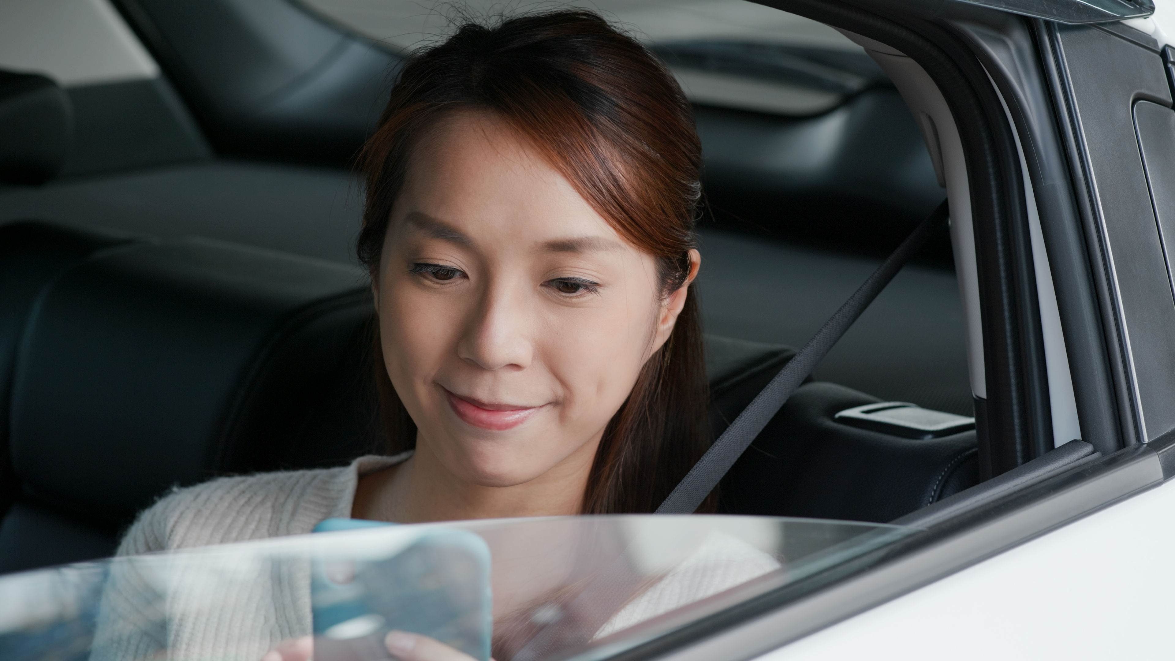 A woman sitting in a car