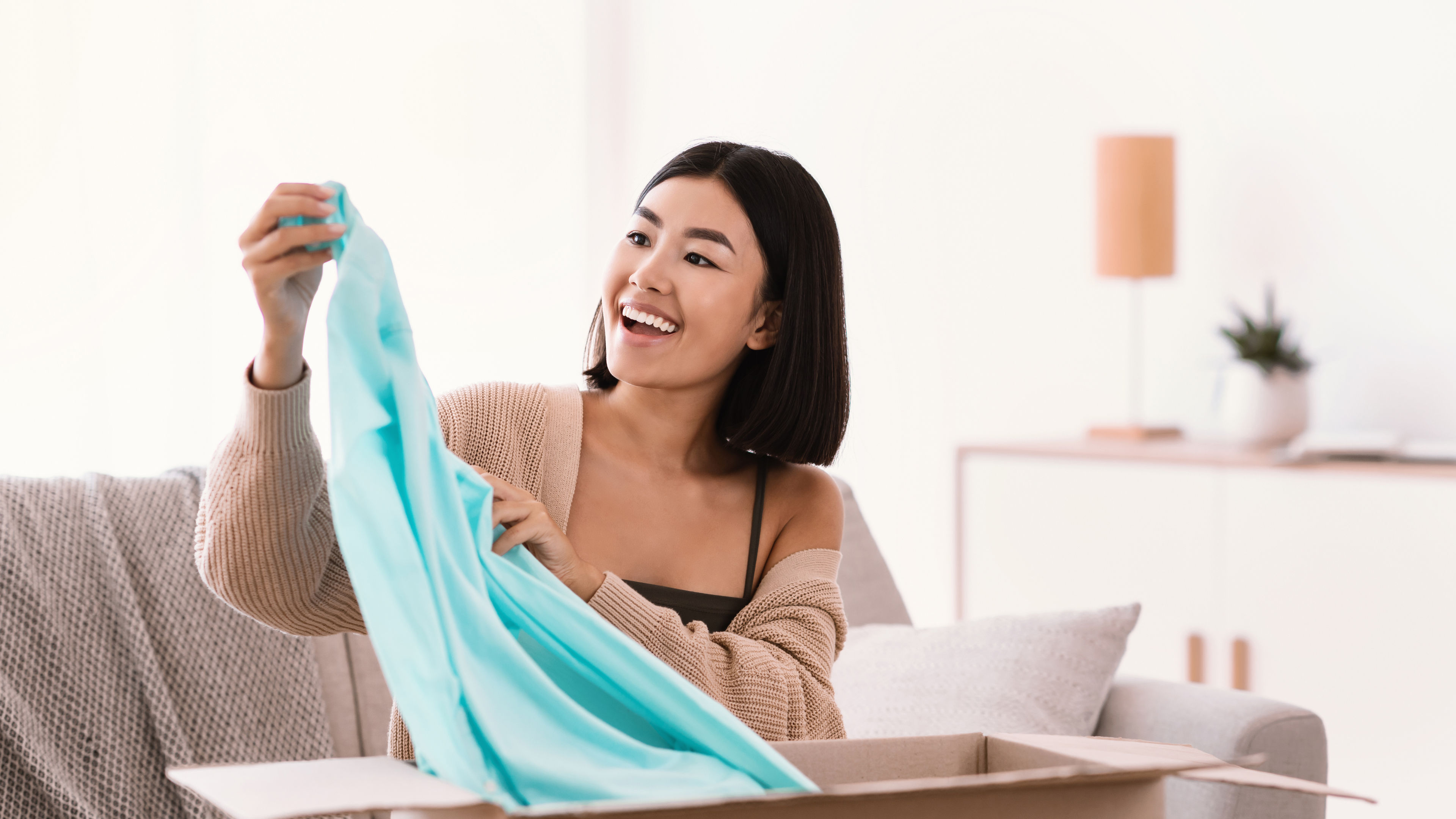 A woman unpacking clothes. 