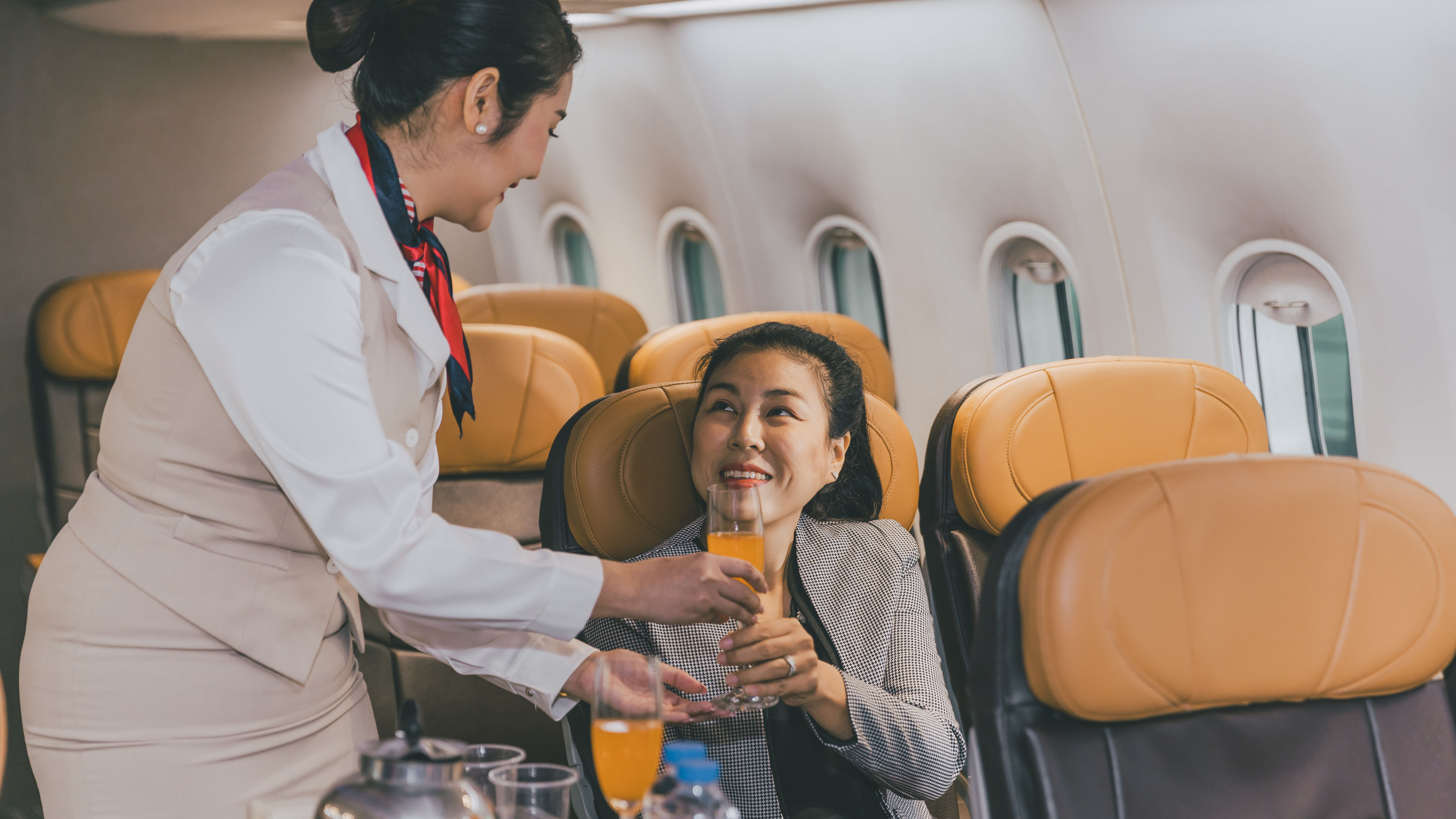 Air hostess flight cabin crew serve food and drink service passenger