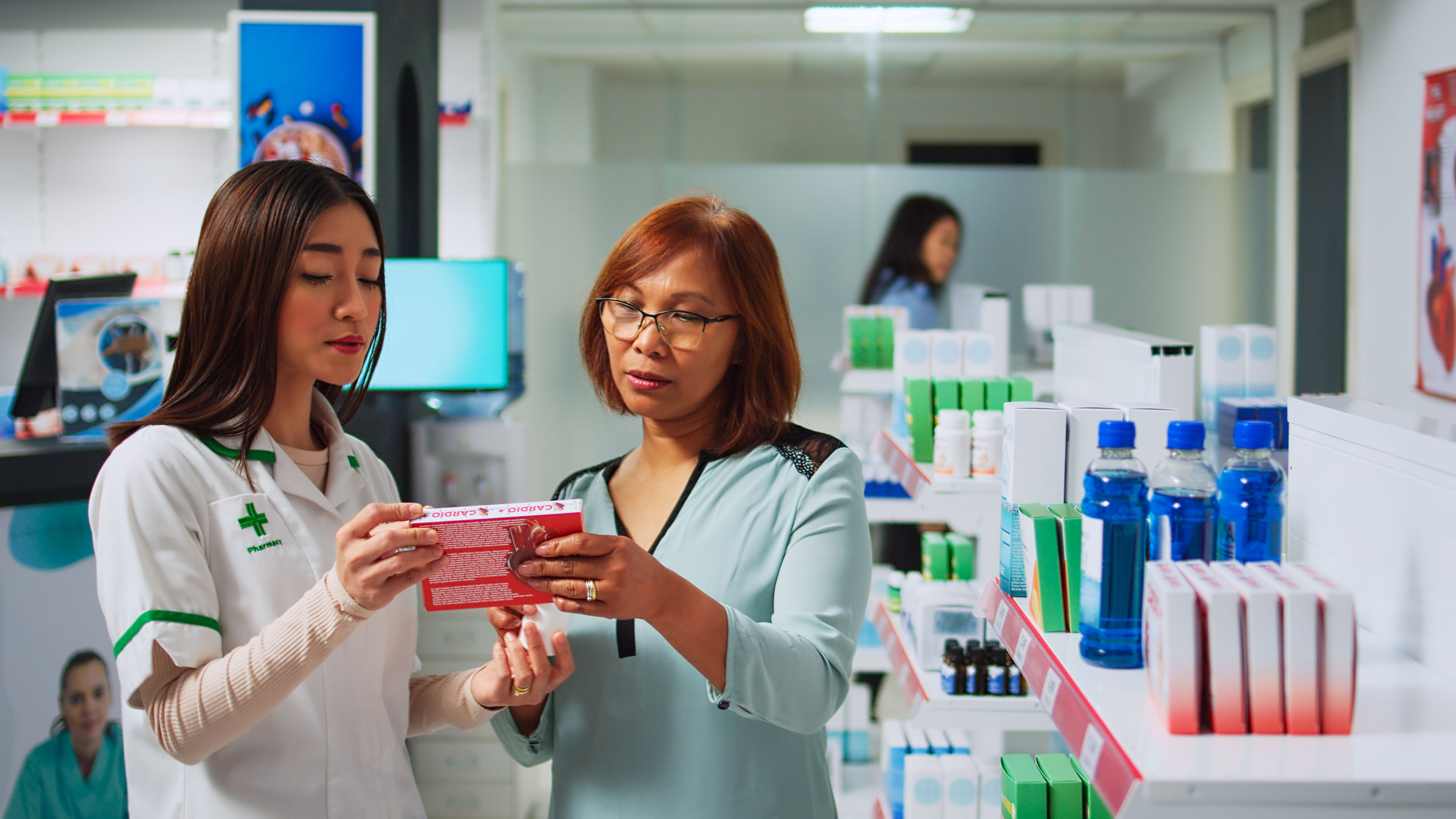 Asian people analysing cardiology medicine with customer 