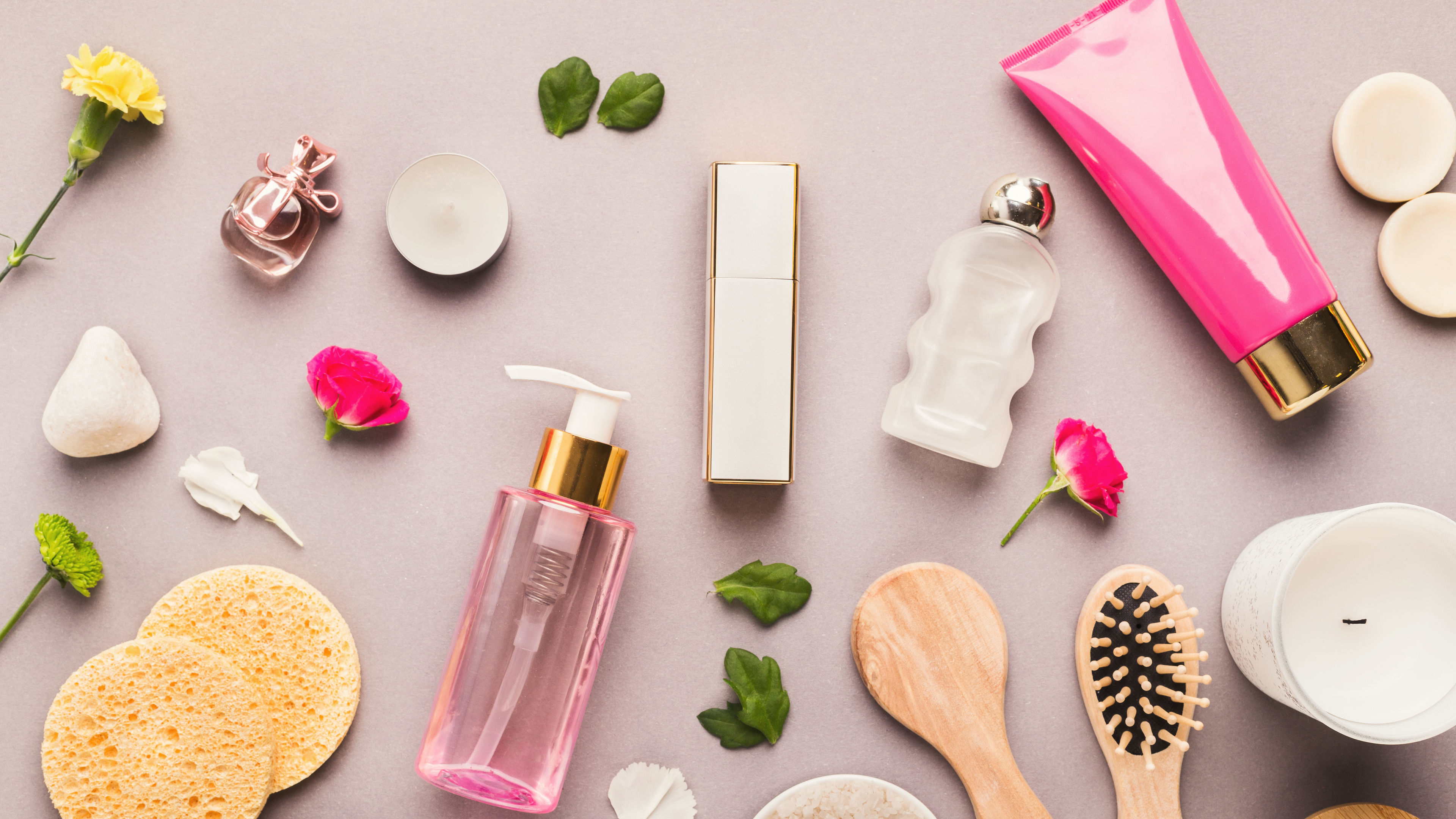 A bundle of cosmetics and spa essentials on a table 