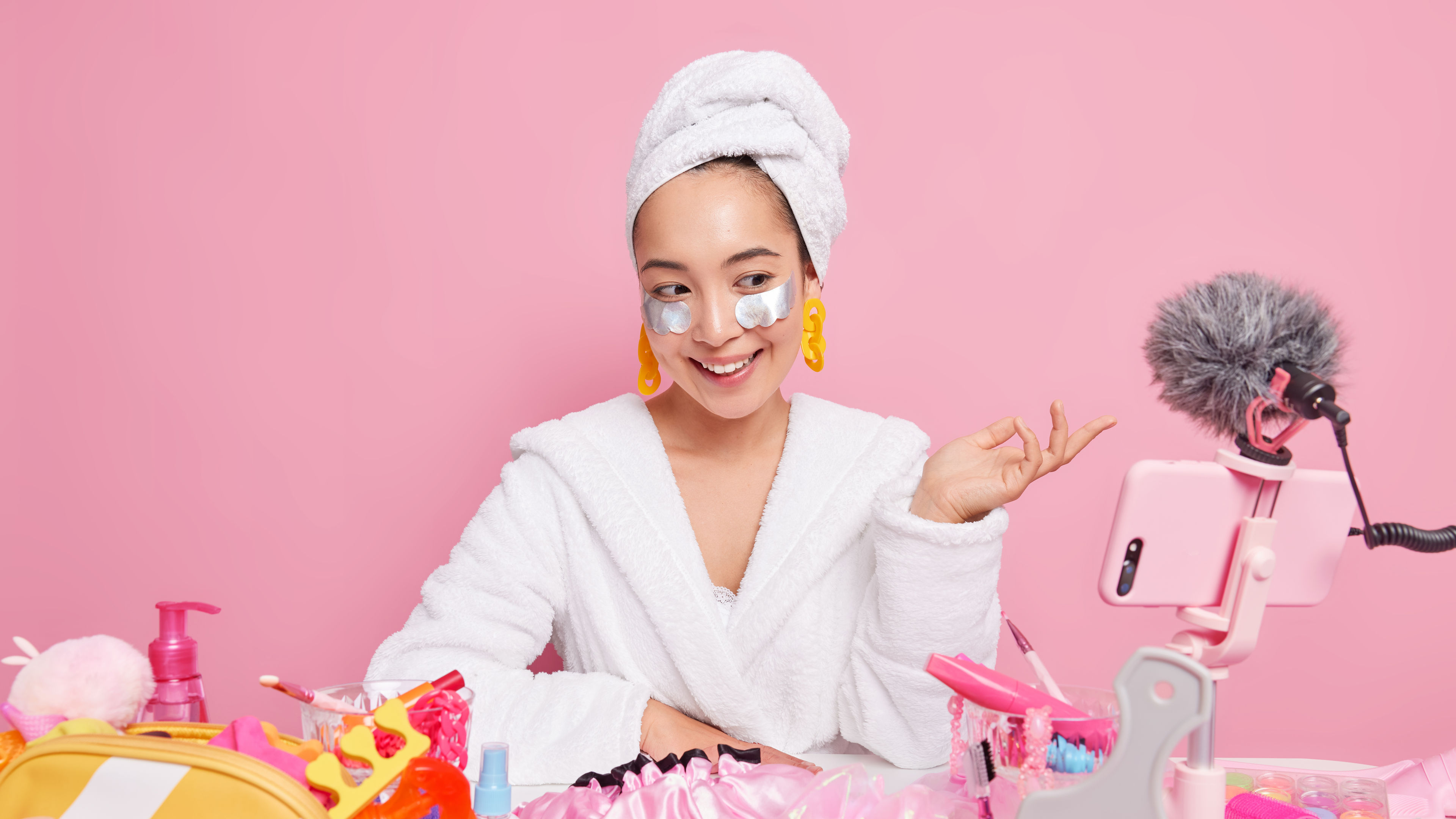 A girl enjoys her skincare routine, gently applying moisturiser for a radiant glow. 