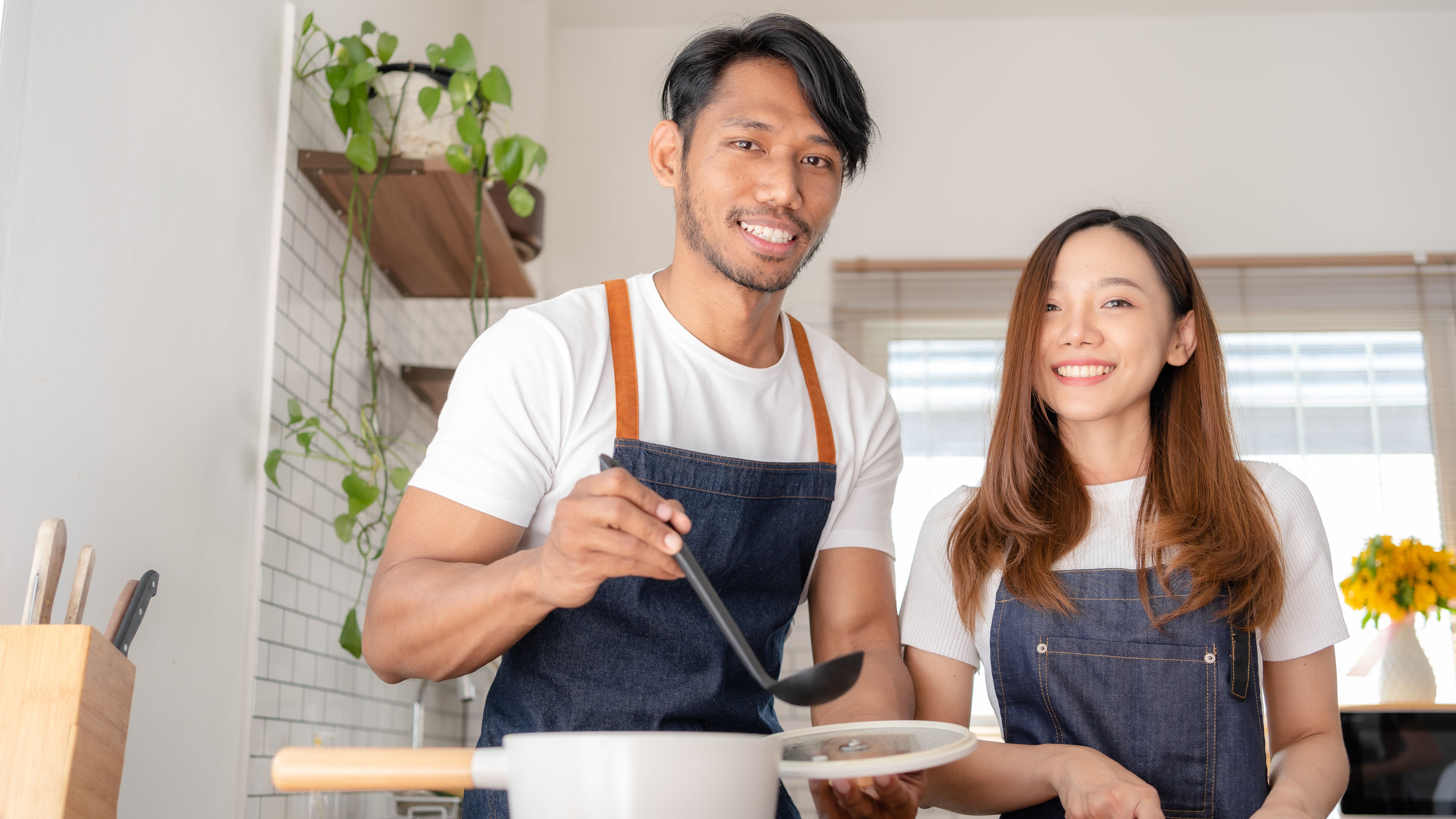 Happy couple cooking together