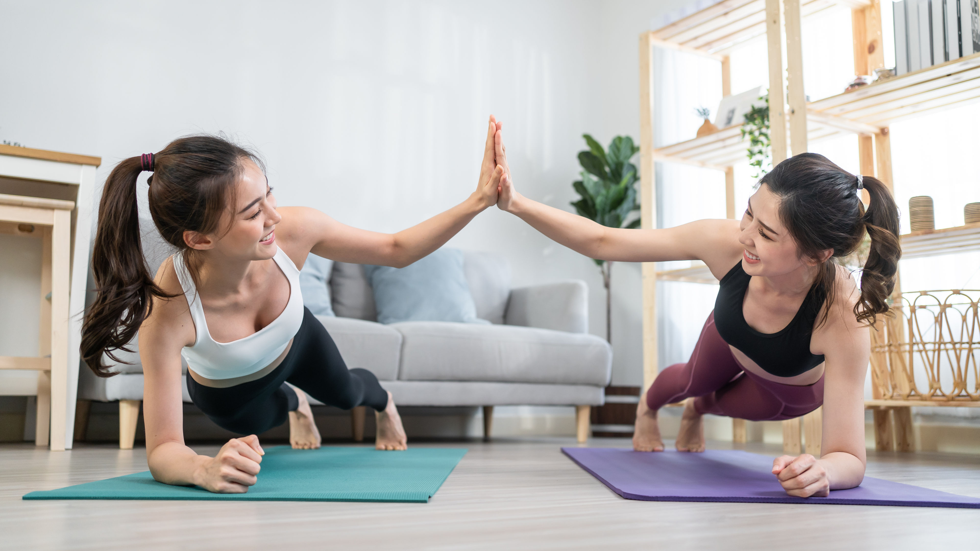 Two women doing yoga