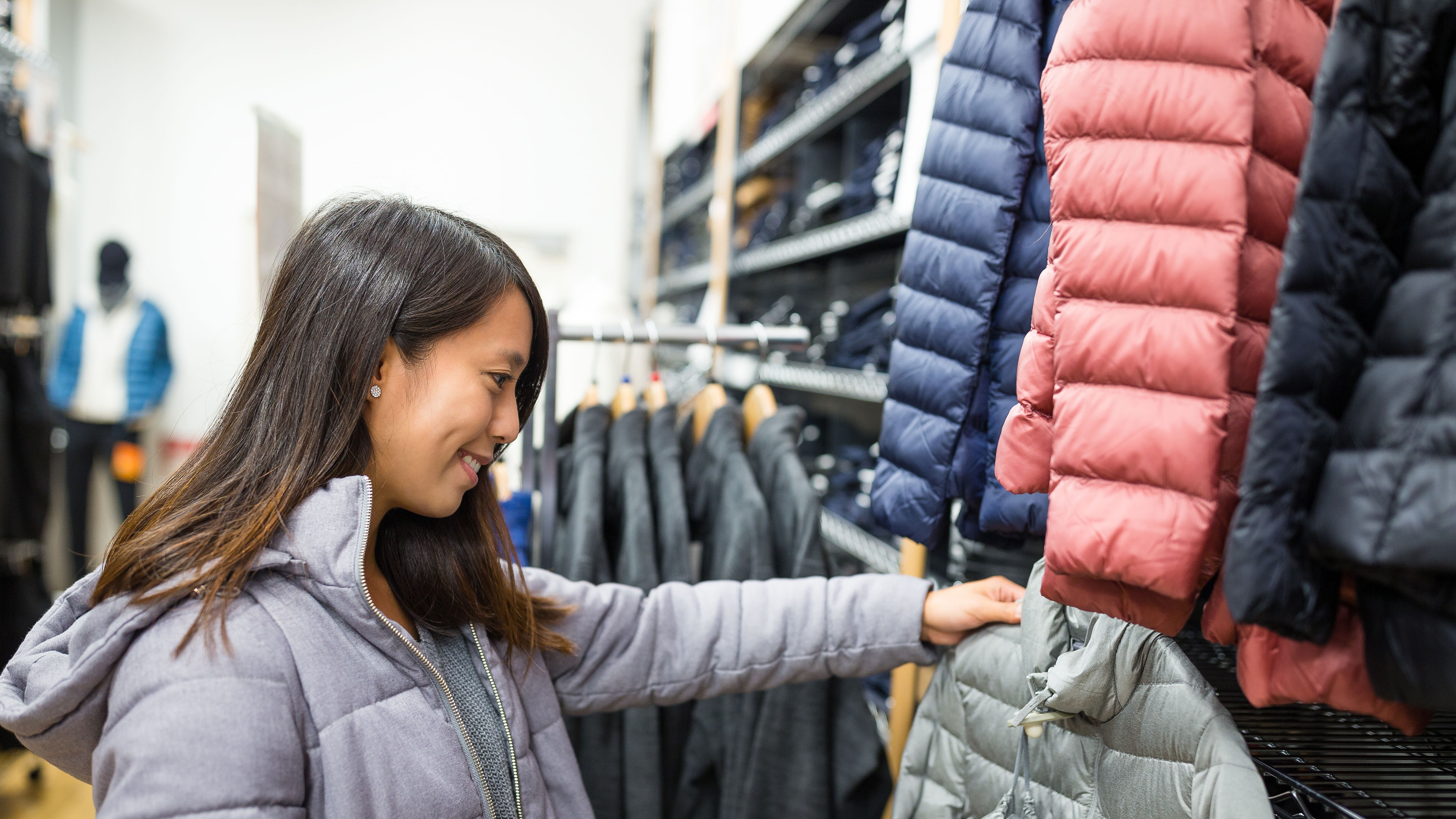 Woman choosing jackets 