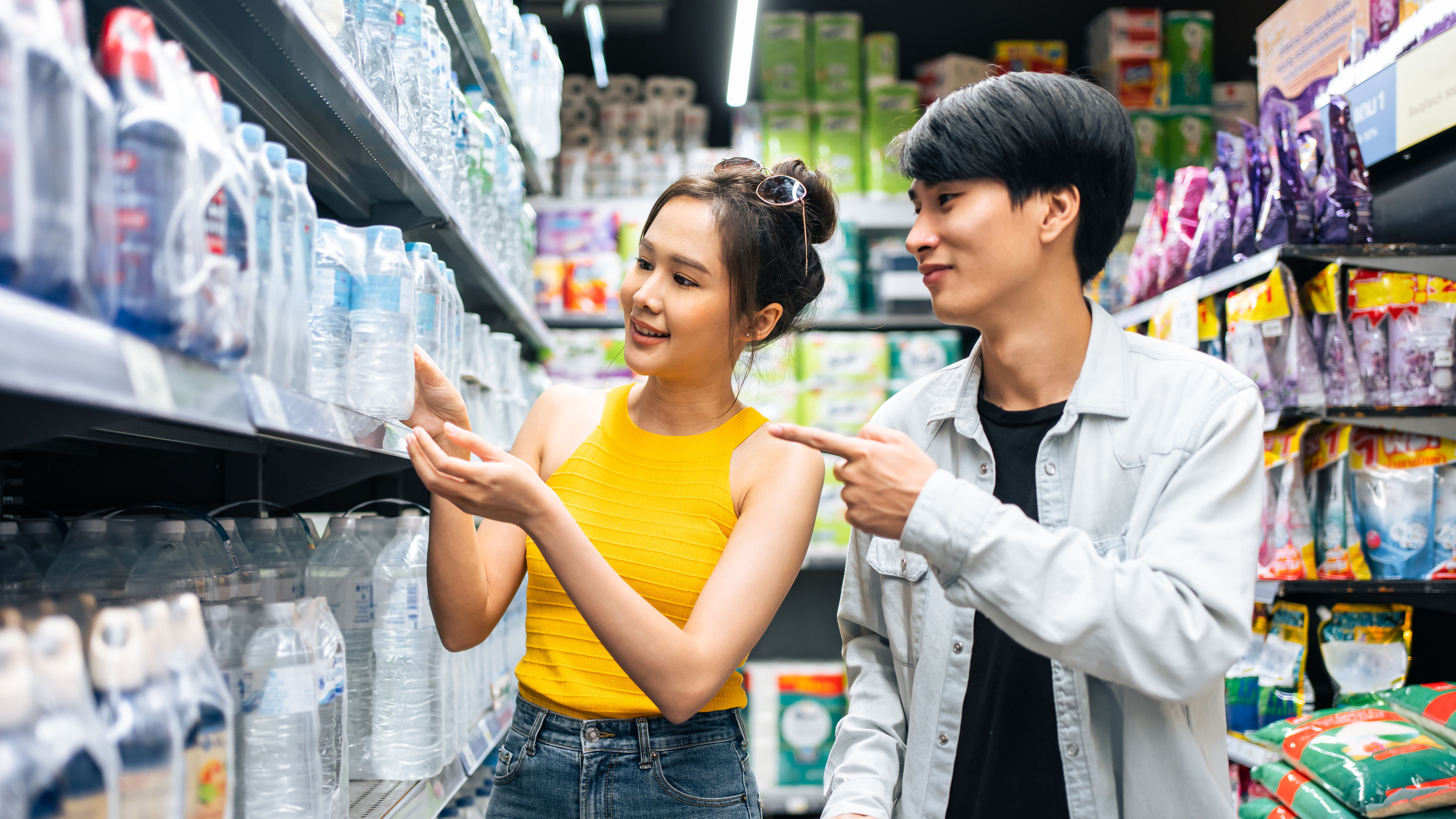 Young couple shopping in supermarket  