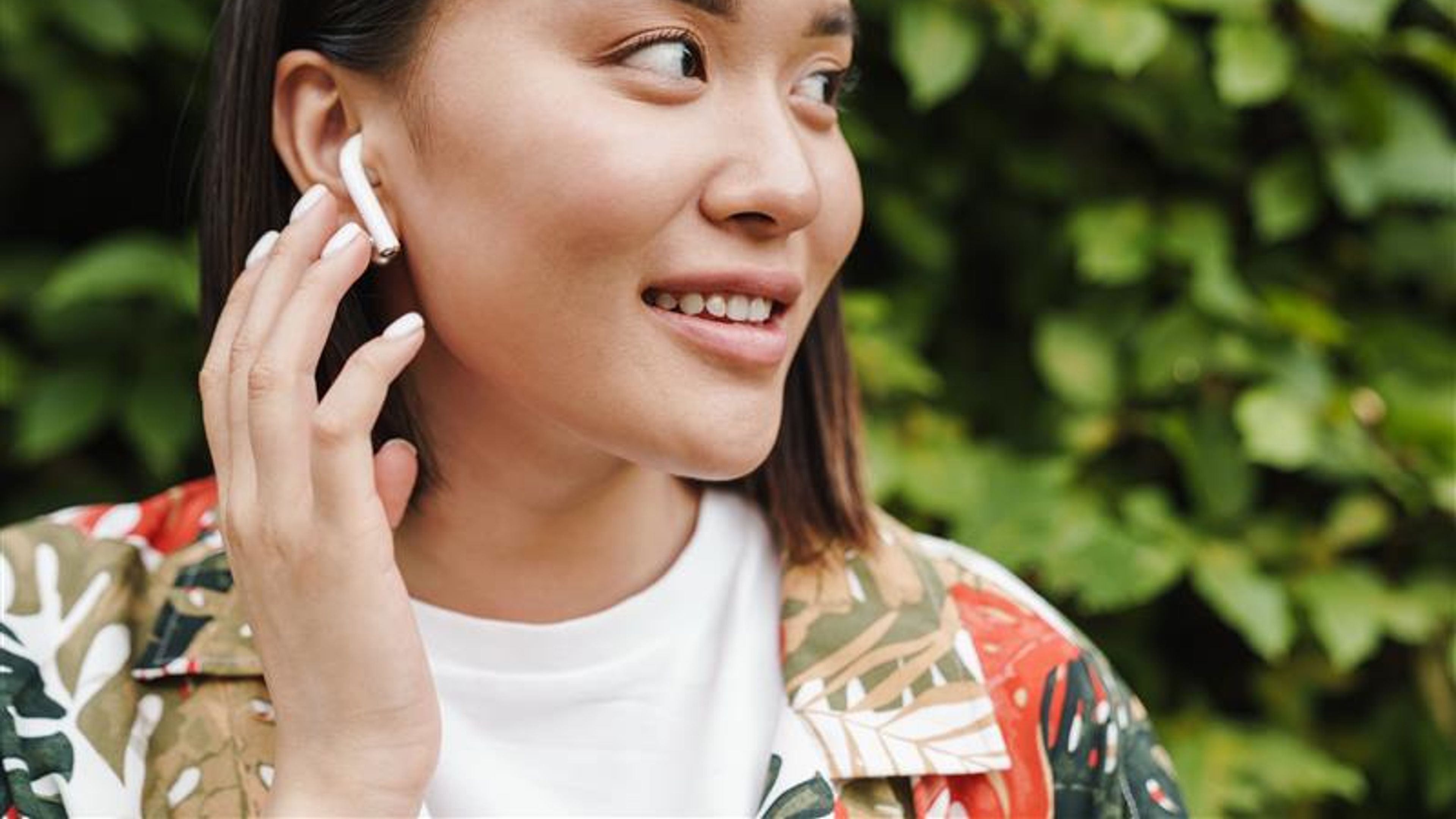 Young woman with earbud